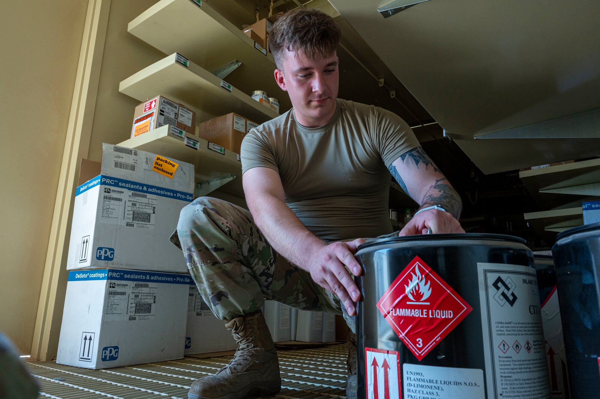 U.S. Air Force Senior Airman Christian Goodwin, 49th Logistics Readiness Squadron HAZMART journeyman, organizes flammable liquid canisters at Holloman Air Force Base, New Mexico, July 18, 2024. The HAZMART section is responsible for shipping and storing a wide range of hazardous materials, ensuring safe delivery to multiple organizations across the base. (U.S. Air Force photo by Senior Airman Isaiah Pedrazzini)