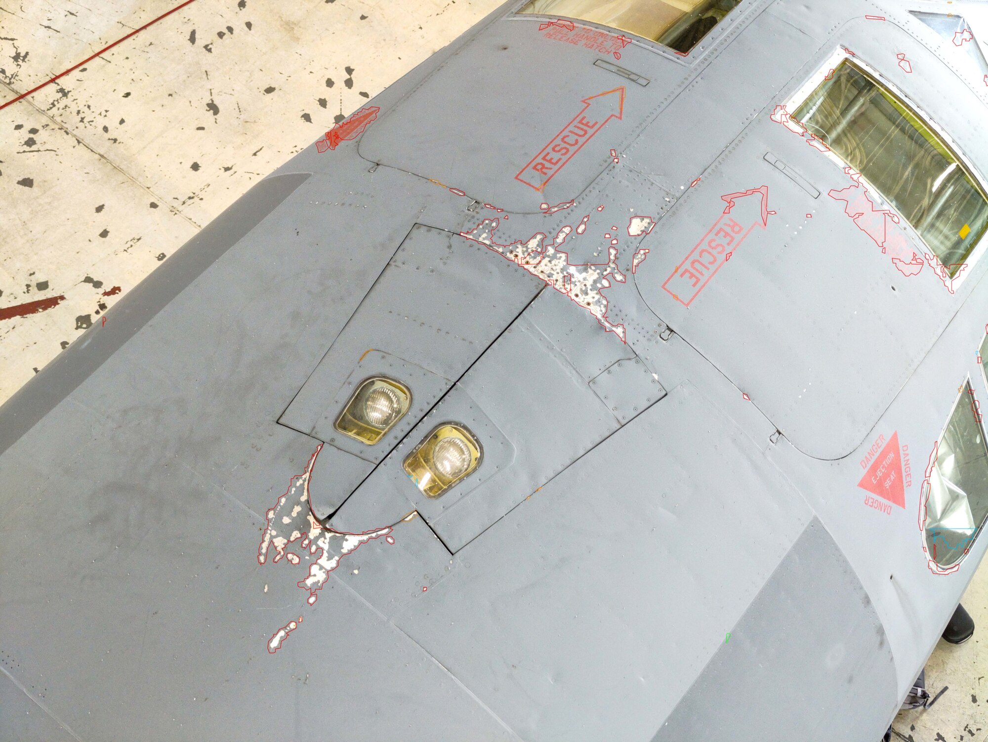 Damages made to the skin of a B-52 Stratofortress are outlined in red after being identified by drones at Barksdale Air Force Base.