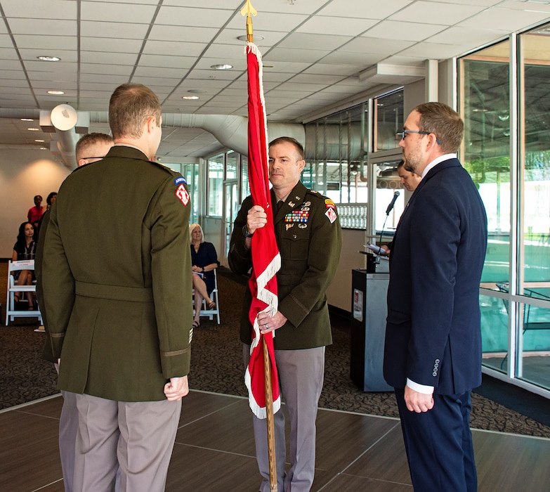 The new commander of the Albuquerque District, Lt. Col. Matthew Miller, holds the USACE flag after receiving it from South Pacific Division Commander Col. James Handura during the change of command ceremony in Albuquerque, N.M., July 18, 2024.