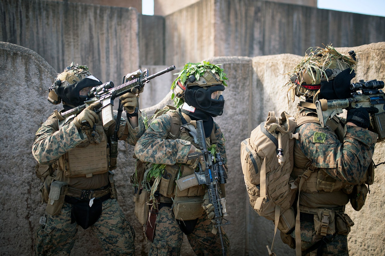 Marines assigned to Charlie Company, Battalion Landing Team 1/5, 15th Marine Expeditionary Unit, stack up before entering an unsecured building during force-on-force training at Marine Corps Training Area Bellows, Waimanalo, Hi., July 23, 2024.