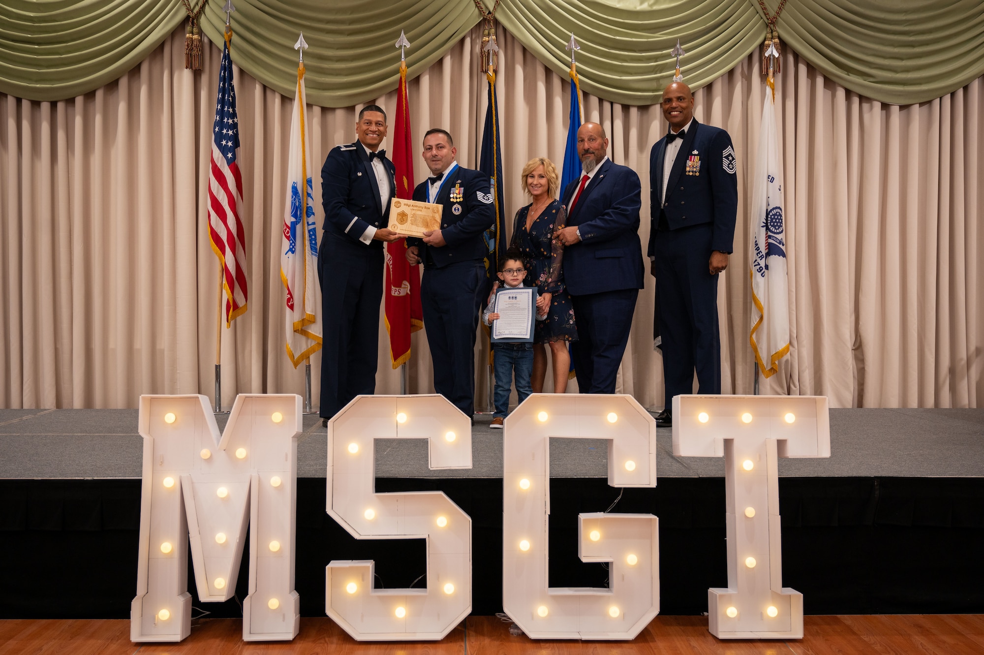 U.S. Air Force Master Sgt. selects participate in a Senior Noncommissioned Officer Induction ceremony at Joint Base McGuire-Dix-Lakehurst, N.J., July 19, 2024. The ceremony is a traditional rite of passage used by SNCOs to convey the special pride felt when newly promoted sergeants enter the highest echelon of the NCO corps. (U.S. Air Force photo by 2nd Lt. Alexis Kula)