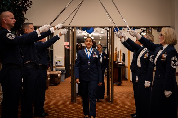 U.S. Air Force Master Sgt. selects participate in a Senior Noncommissioned Officer Induction ceremony at Joint Base McGuire-Dix-Lakehurst, N.J., July 19, 2024. The ceremony is a traditional rite of passage used by SNCOs to convey the special pride felt when newly promoted sergeants enter the highest echelon of the NCO corps. (U.S. Air Force photo by 2nd Lt. Alexis Kula)