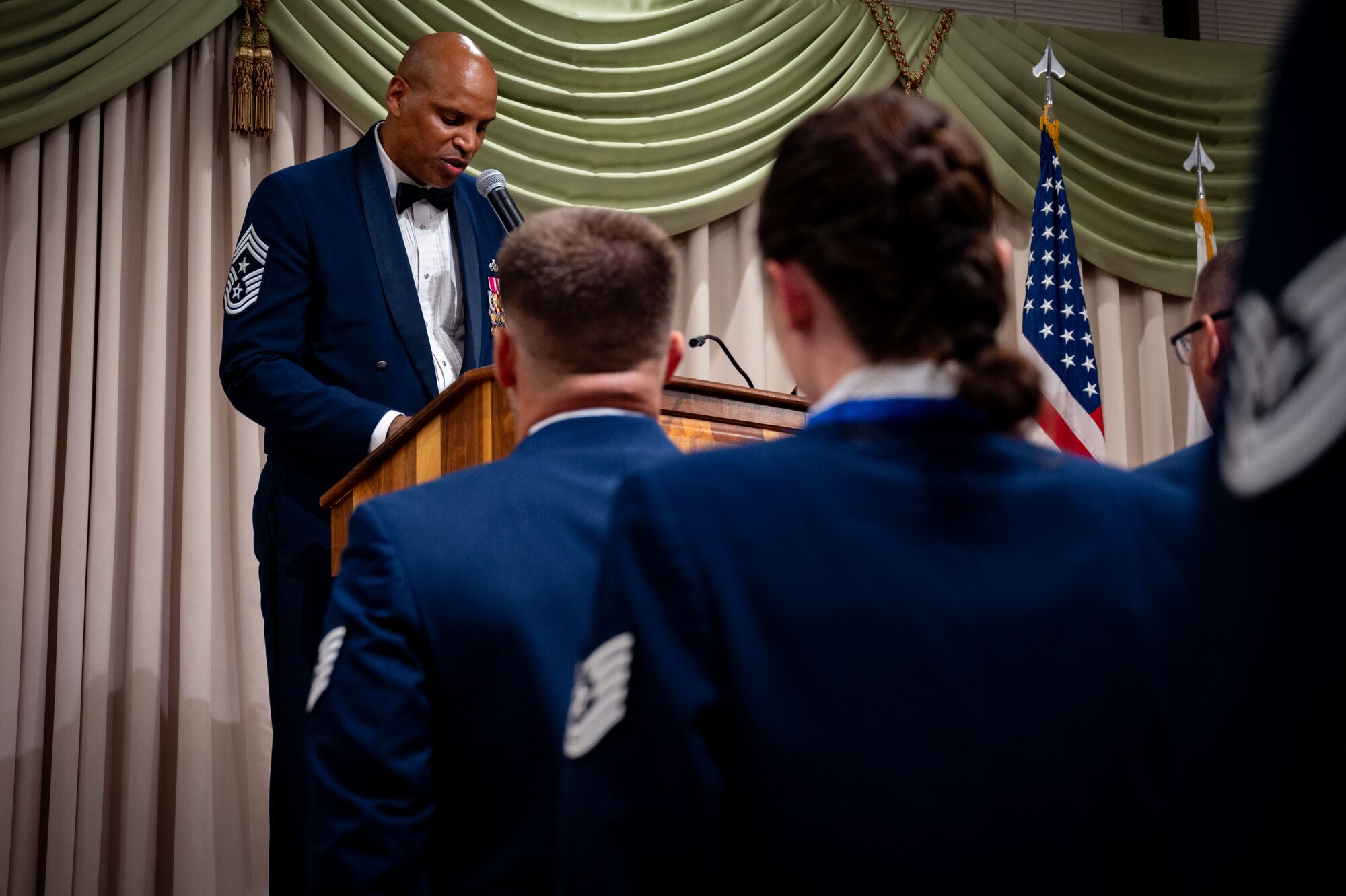 U.S. Air Force Chief Master Sgt. Michael Wynne, 87th ABW command chief, gives remarks during a Senior Noncommissioned Officer Induction ceremony at Joint Base McGuire-Dix-Lakehurst, N.J., July 19, 2024. The ceremony is a traditional rite of passage used by SNCOs to convey the special pride felt when newly promoted sergeants enter the highest echelon of the NCO corps. (U.S. Air Force photo by 2nd Lt. Alexis Kula)
