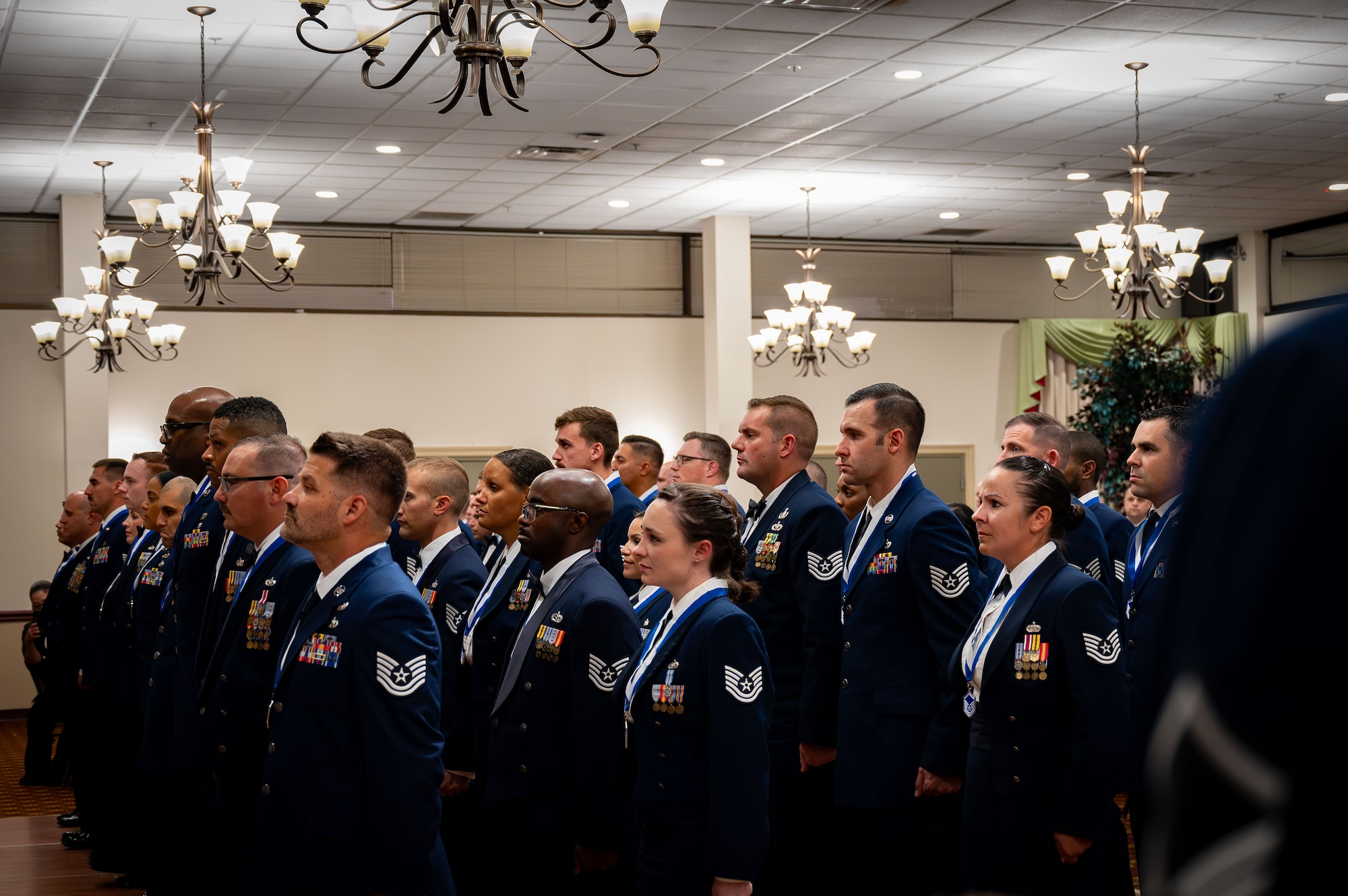 U.S. Air Force Master Sgt. selects participate in a Senior Noncommissioned Officer Induction ceremony at Joint Base McGuire-Dix-Lakehurst, N.J., July 19, 2024. The ceremony is a traditional rite of passage used by SNCOs to convey the special pride felt when newly promoted sergeants enter the highest echelon of the NCO corps. (U.S. Air Force photo by 2nd Lt. Alexis Kula)