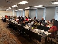 Mary Ball, far right, listens with Transition Coordinators to Sgt. Major Imari Jackson at the 2024 Transition Coordinator Sustainment Training