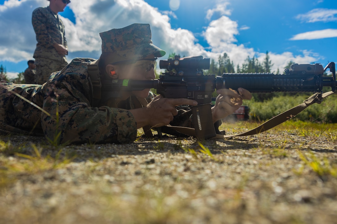 U.S. Marine Corps Lance Cpl. Aiden Hagenbrock, an automotive maintenance technician with Combat Logistics Battalion 8, 2nd Marine Logistics Regiment, 2nd Marine Logistics group, conducts a zero confirmation before participating in a table five shoot during Marine Rotational Forces Europe 24.2 in Haltdalen, Norway, July 16, 2024. MRF-E focuses on regional engagements throughout Europe by conducting various exercises, mountain-warfare training, and military-to-military engagements, which enhances the overall interoperability of the U.S. Marine Corps with allies and partners. (U.S. Marine Corps Photos by Cpl. Jackson Kirkiewicz)