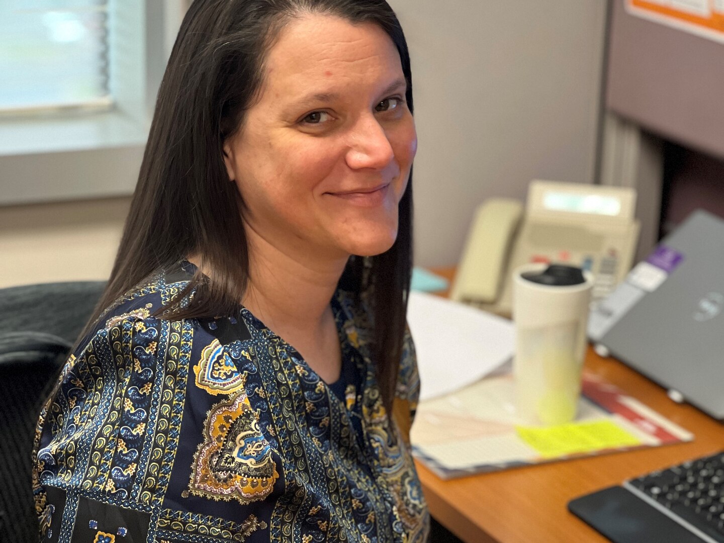 Photo of a smiling woman.