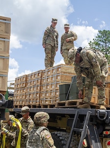 Soldiers assigned to the 53rd Brigade Support Battalion prepared to unload ammunition they have just transported from an ammunition supply point to an ammunition holding area at Camp Shelby, Mississippi, July 15, 2024. These Soldiers are among almost 5,000 Florida Army National Guard Soldiers mobilized to Camp Shelby to support the eXportable Combat Training Capability exercise, a major training event that ensures the 53rd Infantry Brigade Combat Team’s readiness and proficiency to deploy