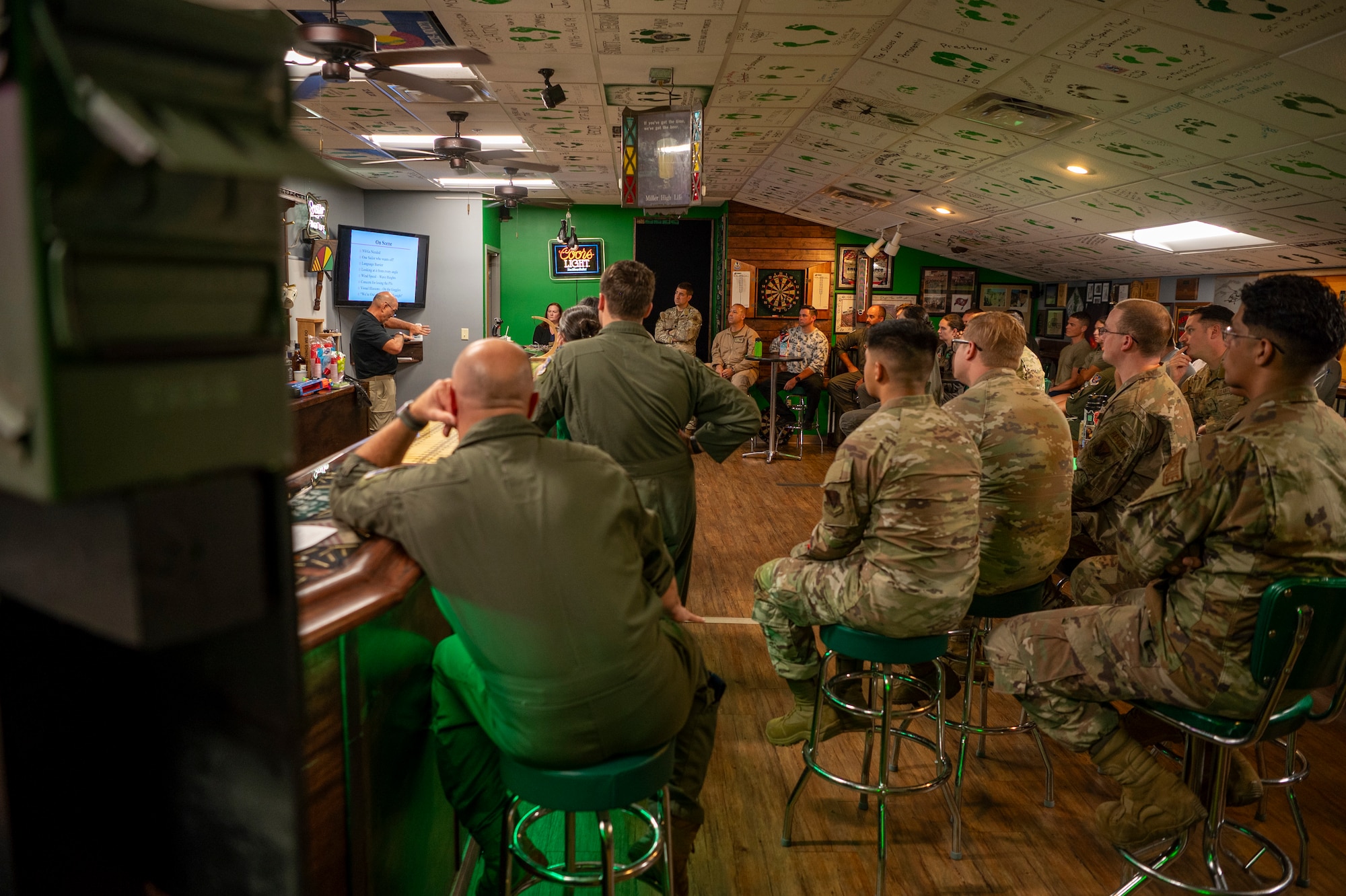 U.S. Air Force Airmen assigned to the 23rd Wing listen to Mr. Dave Rivola, the real-life inspiration for the film “The Perfect Strom” conduct a mission brief at Moody Air Force Base, Georgia, July 23, 2024. Rivola was the helicopter rescue pilot from the 106th Rescue Wing in the New York Air National guard that flew out to search for the fishing vessel “Andrea Gail” in 1991. (U.S. Air Force photo by Senior Airman Leonid Soubbotine)