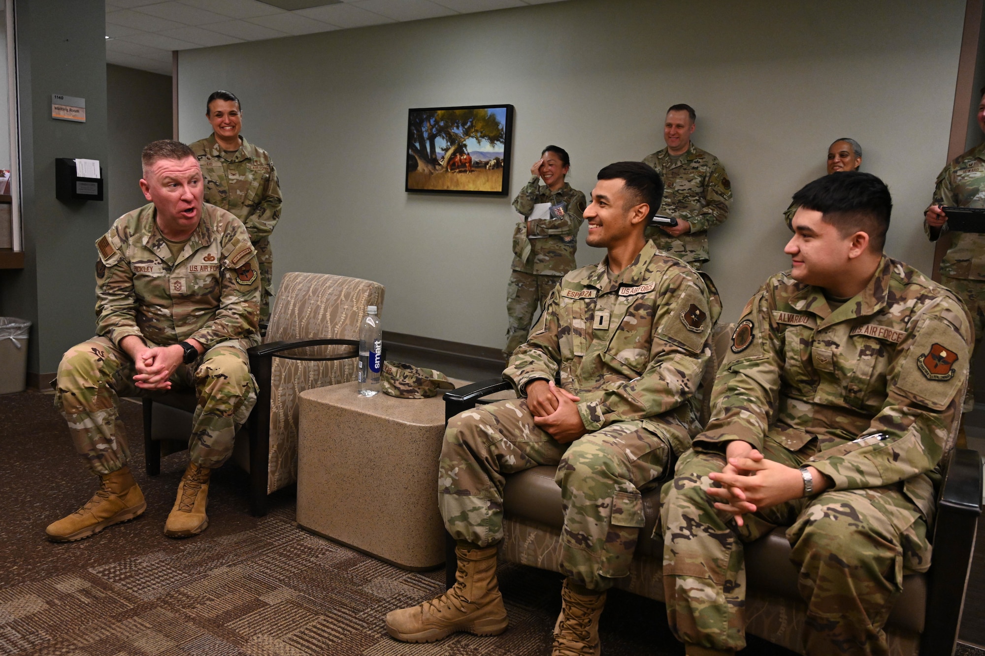 U.S. Air Force Chief Master Sgt. Chad Bickley, command chief of Air Education and Training Command, speaks to 1st Lt. Aziel Espinoza, 97th Operational Medical Readiness Squadron (OMRS) Public Health Flight commander, and Airman Basic Alexander Alvarado, 97th OMRS public health technician, during a tour at Altus Air Force Base, Oklahoma, July 10, 2024. Bickley explained the critical role that Airmen play in executing the mission. (U.S. Air Force photo by Senior Airman Miyah Gray)