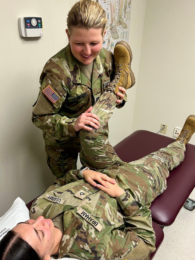 Doctor examining a female soldier