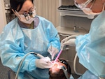Dental team fixing patients' smile.