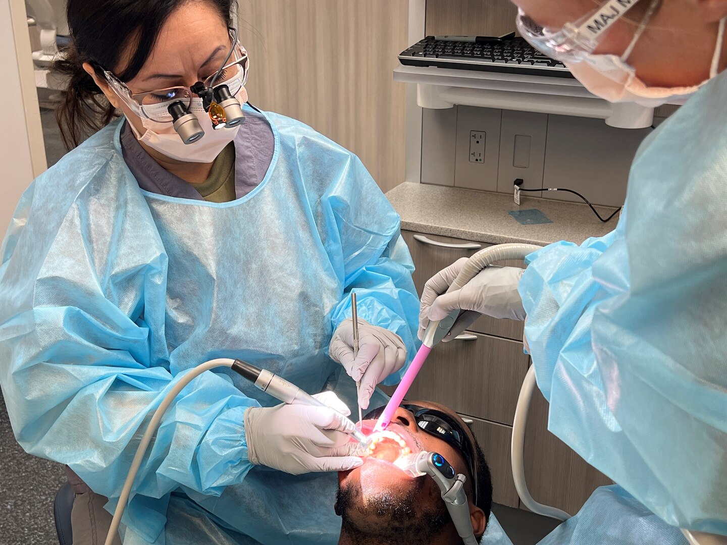 Dental team fixing patients' smile.