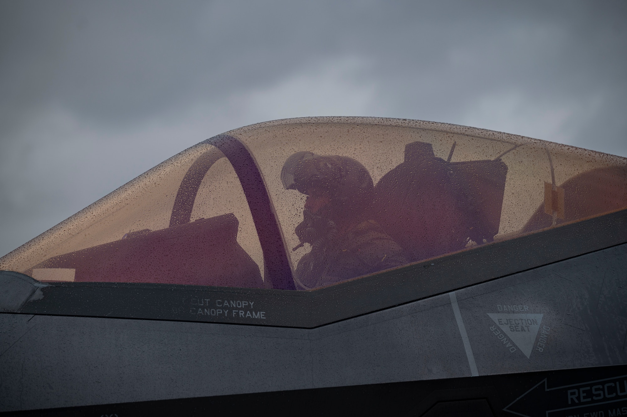 A photo of an F-35 pilot in the cockpit prior to flight