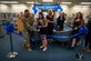 U.S. Air Force Maj. Maria Berardo, 56th Force Support Squadron commander, and Luke Air Force Base library personnel cut the ribbon at the library re-opening, July 24, 2024, at Luke AFB, Arizona. The remodeled library features new books, shelving, carpet, and paint. This initiative falls in line with two Luke AFB’s lines of effort of advancing infrastructure and advancing the quality of life for Airmen and their families.  (U.S. Air Force photo by Airman 1st Class Mason Hargrove)