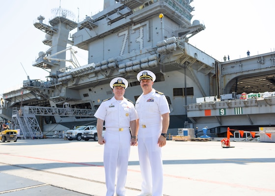 Capt. Daryle Cardone, left, commanding officer of Nimitz-class aircraft carrier USS Ronald Reagan (CVN 76), and Capt. Tim Waits, commanding officer of Nimitz-class aircraft carrier USS George Washington (CVN 73), pose for a photo on the pier following a press conference on Naval Air Station North Island, San Diego July 24, 2024.