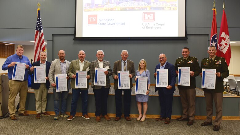 U.S. Army Corps of Engineers Memphis and Nashville Districts and state of Tennessee officials hold signed copies of a memorandum of agreement during the Tennessee Partnership Meeting July 24, 2024, at the Ellington Agriculture Center in Nashville, Tennessee.