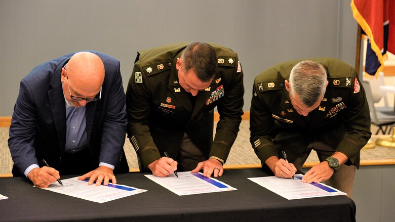 David Salyers, Commissioner of the Tennessee Department of Environment and Conservation, L. Col. Robert Green, commander of the U.S. Army Corps of Engineers Nashville District, and Col. Brian Sawser commander of the U.S. Army Corps of Engineers Memphis District signing the 2024 Tennessee Partnering Agreement, July 24, 2024, during the Tennessee Partnering Meeting at Ellington Agriculture Center in Nashville, Tennessee.