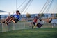 Luke Air Force Base children enjoy a carnival ride during the 2024 Freedom Fest, July 3, 2024, at Luke AFB, Arizona. Freedom Fest allowed Luke AFB community members to come together and celebrate the upcoming fourth of July holiday. (U.S. Air Force photo by Senior Airman Jakob Hambright)