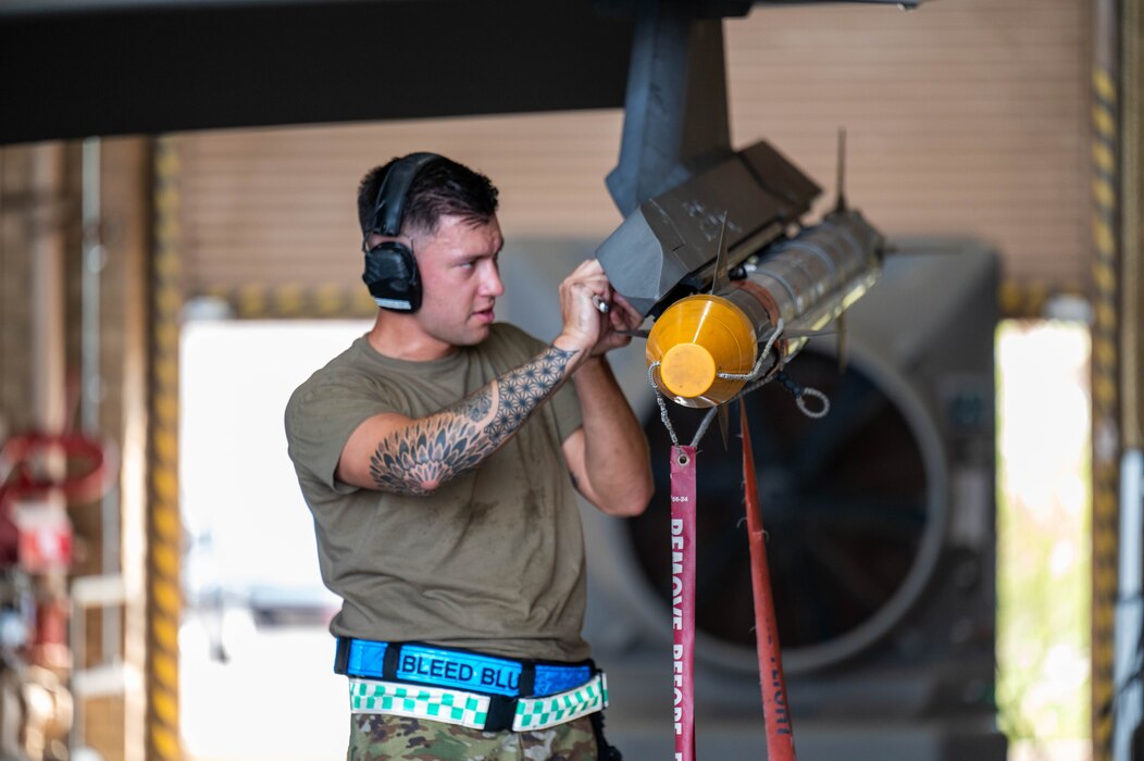 U.S. Air Force Staff Sgt. Brandon Castillo, 308th Aircraft Maintenance Unit maintainer, secures an AIM-9X Sidewinder missile during the 56th Maintenance Group 2nd quarter weapons load competition, July 12, 2024, at Luke Air Force Base, Arizona.