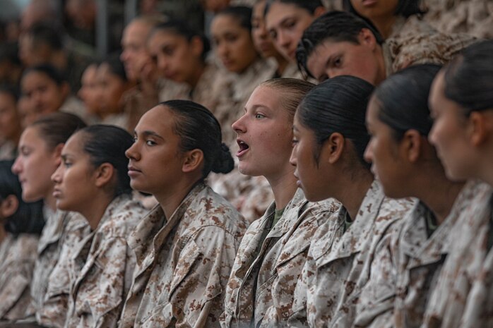 U.S. Marine Corps recruits with Fox Company, 2nd Recruit Training Battalion, receive instruction prior to a water survival training class at Marine Corps Recruit Depot San Diego, California, July 23, 2024. Recruits are taught basic water survival prior to conducting their basic swim qualification. Basic swim qualification consists of a 25-meter swim, a 10-foot tower jump into the water, four-minute tread, 25-meter pack swim and an underwater gear shed. (U.S. Marine Corps photo by Lance Cpl. Alexandra M. Earl)