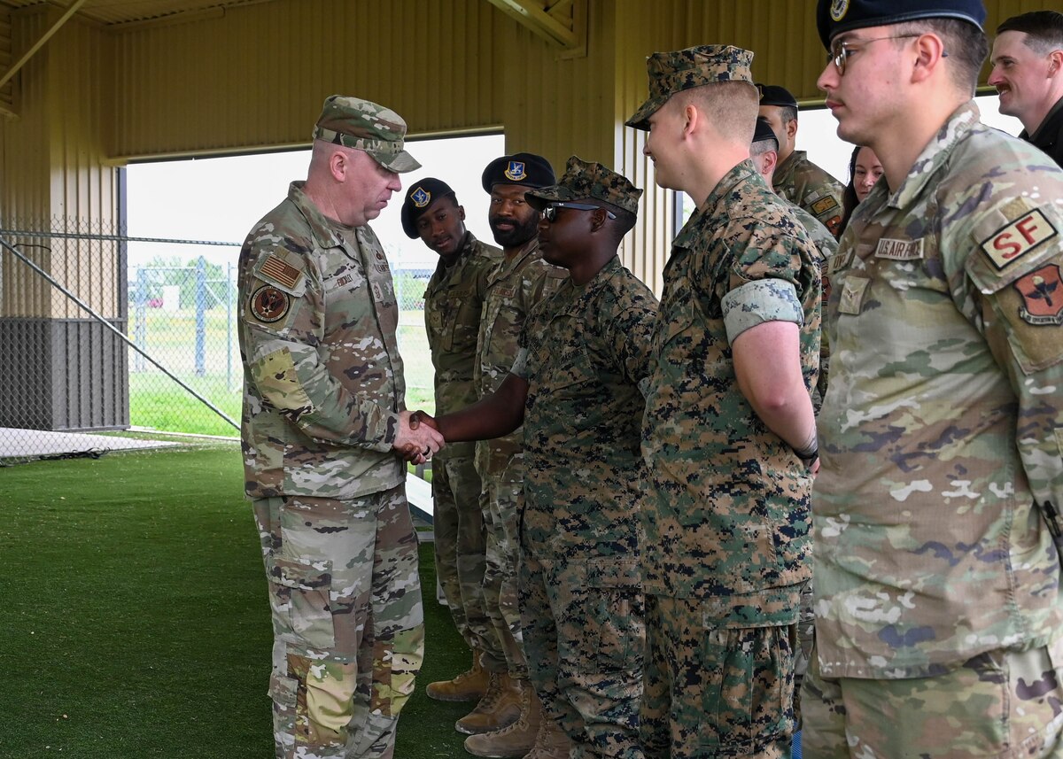 U.S. Air Force Chief Master Sgt. Chad Bickley, command chief for Air Education Training Command, meets with defenders at Goodfellow Air Force Base, Texas, May 10, 2024. Members of the 17th Security Forces Squadron train joint service students awaiting training to serve as auxiliary security forces. (U.S. Air Force photo by Senior Airman Zach Heimbuch)