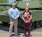 Photo of Paul DePrimo and Jennifer Caldero standing in front of a tank