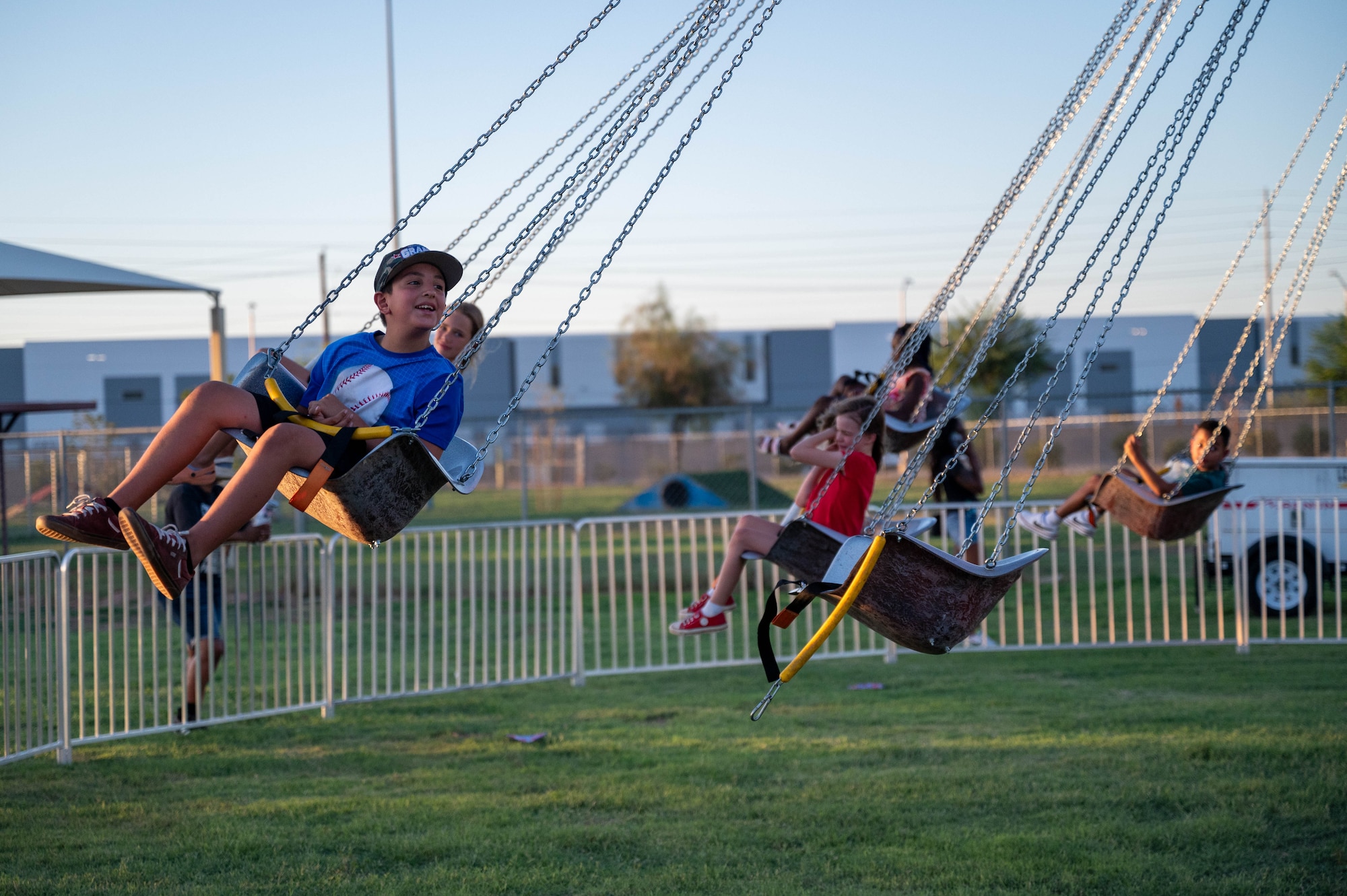 Luke Air Force Base children enjoy a carnival ride during the 2024 Freedom Fest, July 3, 2024, at Luke AFB, Arizona.