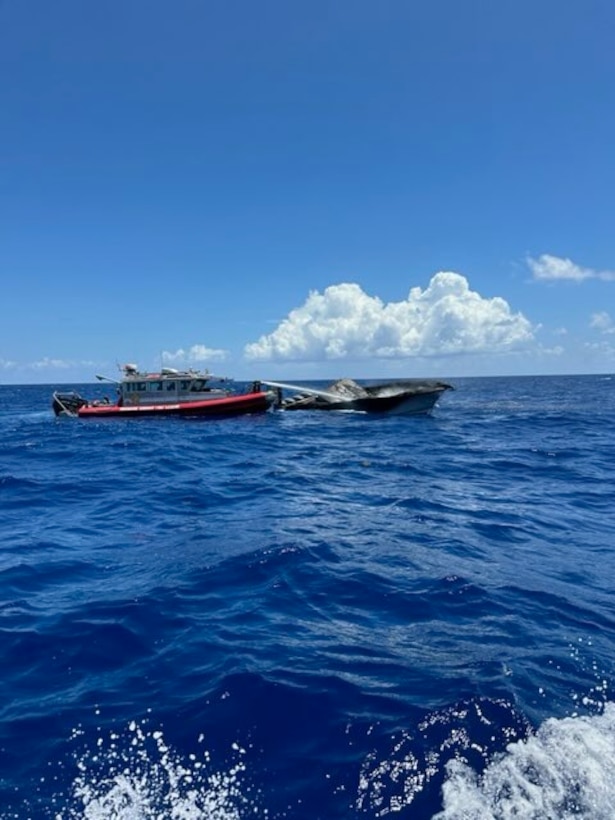 The Coast Guard Cutter Bernard C. Webber arriving on the scene of a burning 42-foot cabin cruiser near Dania Beach, Florida, July 25, 2024. Coast Guard and Broward Fire Rescue boat crews rescued two people with no medical concerns before extinguishing the flames.