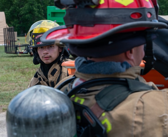 Firefighter prepare to put out a simulated fire