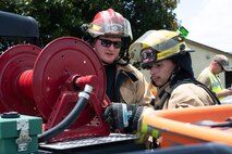 Firefighters put away equipment