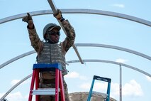 An Airman takes down a tent