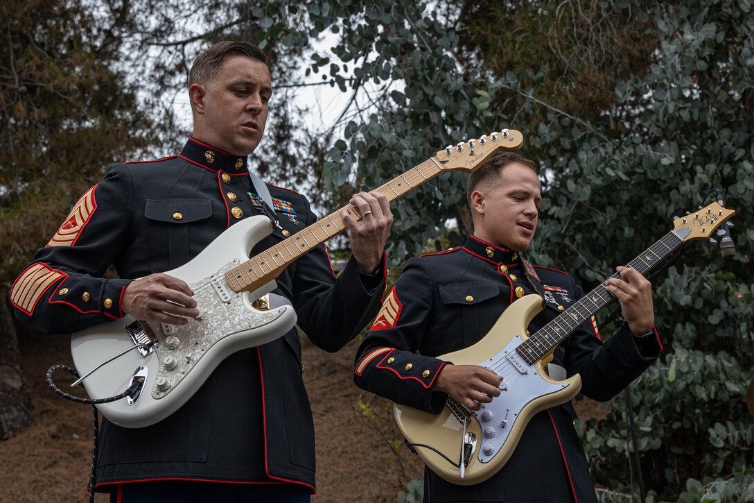 U.S. Marine Corps Master Sgt. Frederick Kern and Sgt. Austin Monnet, both musicians, with the Marine Band San Diego, perform music at KUSI-TV television station San Diego, July 10, 2024. The Marine Band San Diego participated in a live news performance and interview to help promote their neighborhood activation concert in Little Italy. (U.S. Marine Corps photo by Cpl. Sarah M. Grawcock)