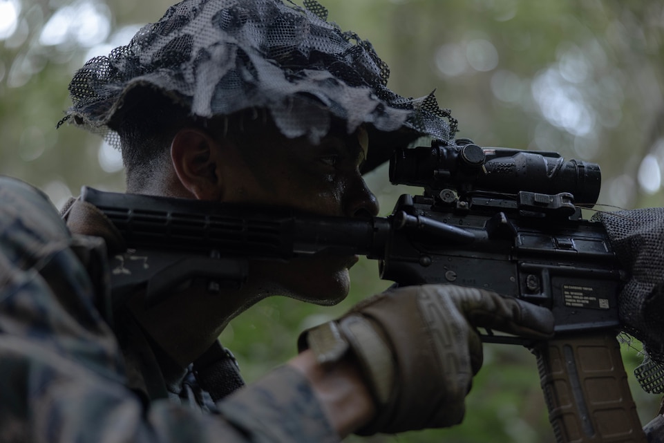 U.S. Marine Corps Lance Cpl. Angel Caldero with III Marine Expeditionary Force Information Group, posts security during Certification Exercise 24.3 at Camp Hansen, Okinawa, Japan, July 17, 2024. CERTEX 24.3 is a training exercise designed to assess, evaluate, and certify 5th ANGLICO’s ability to coordinate fires and effects, integrate with ally and partner forces, and operate independently in dynamic and challenging environments.