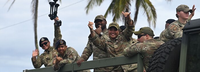 U.S. Air Force Airmen from the 36th Wing, Andersen Air Force Base, Guam, pose during the 80th Guam Liberation Day parade in Hagatna, Guam, July 21, 2024.
