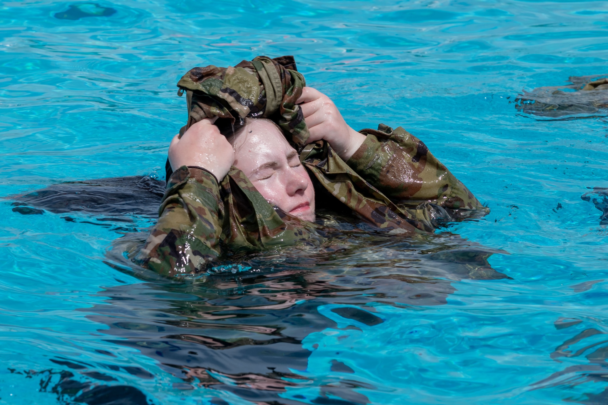 736th Security Forces Squadron Airmen participate in water confidence training on Andersen Air Force Base, Guam, July 24, 2024. In the latter weeks of July the 736th SFS participated in a Jungle Training Course aimed to enhance ground force capabilities in a jungle environment. They learned different survival skills such as water confidence, water purification, trap making, evasion tactics and other skills useful in jungle warfare. (U.S. Air Force photo by Airman 1st Class Audree Campbell)
