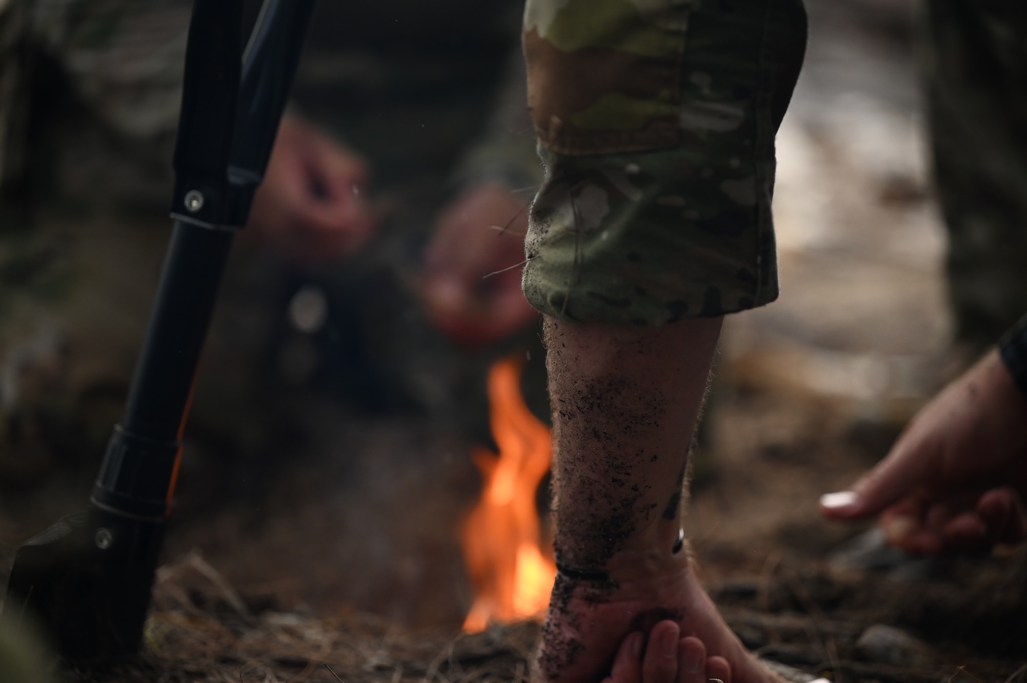 736th Security Forces Squadron Airmen create a fire during a Jungle Training Course on Andersen Air Force Base, Guam, July 25, 2024. In the latter weeks of July the 736th SFS participated in a Jungle Training Course aimed to enhance ground force capabilities in a jungle environment. They learned different survival skills such as water confidence, water purification, trap making, evasion tactics and other skills useful in jungle warfare. (U.S. Air Force photo by Airman 1st Class Adasha Williams)