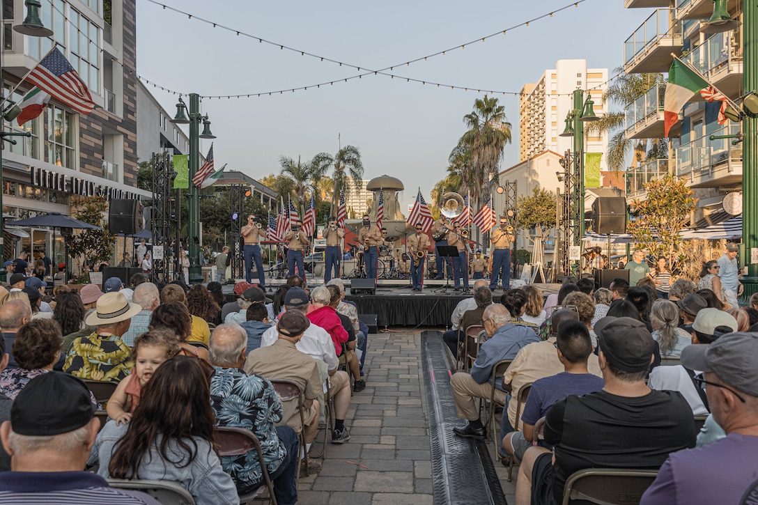 U.S. Marines with Marine Band San Diego perform during a neighborhood activation event in Little Italy, San Diego, California, July 13, 2024. The Marine Band San Diego’s job is to boost morale, participate in outreach work and attend events and ceremonies. (U.S. Marine Corps photo by Lance Cpl. Alexandra M. Earl)