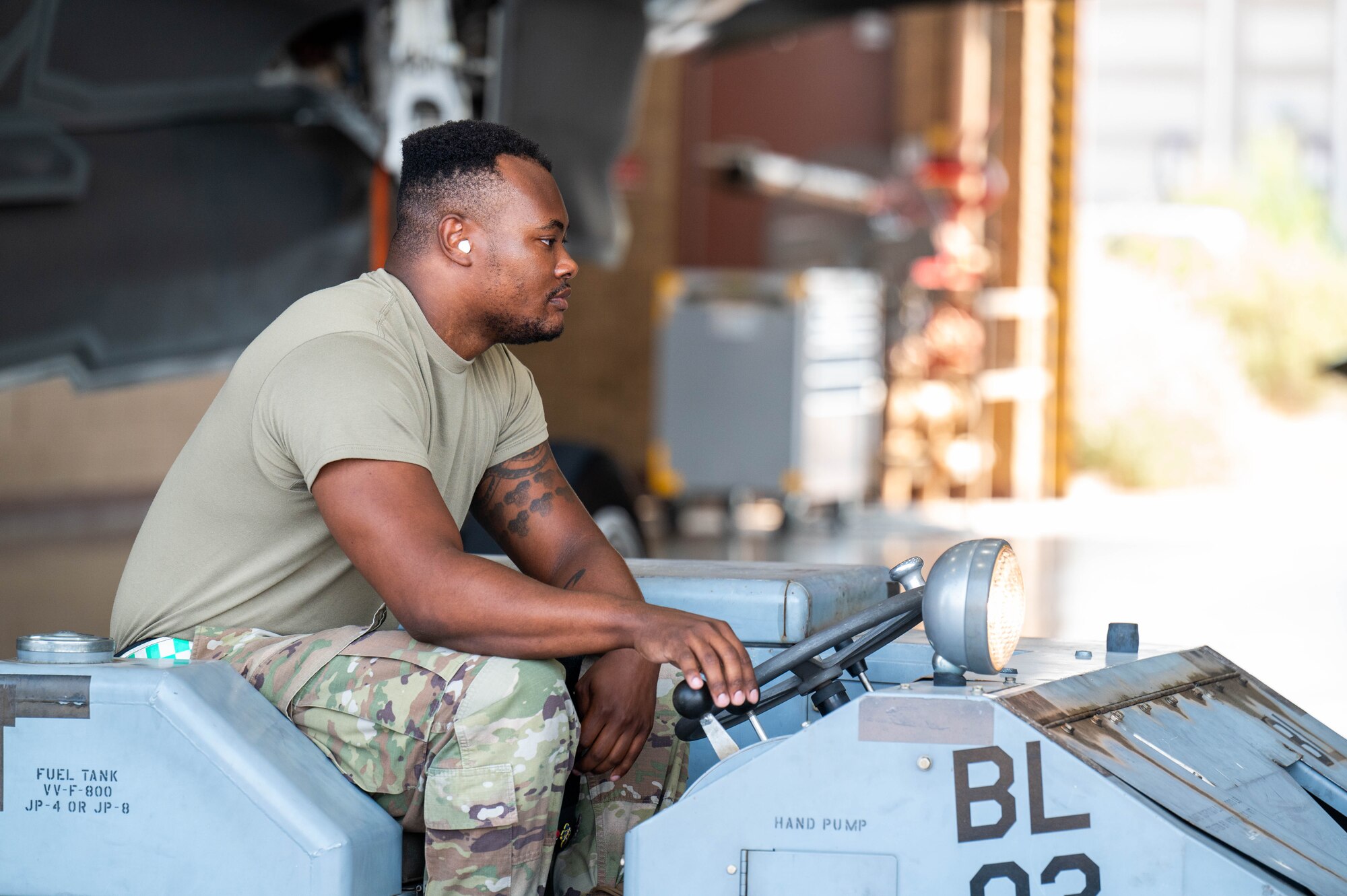 U.S. Air Force Senior Airman Jaire Whitehead, 310th Aircraft Maintenance Unit maintainer, guides an MJ-1C bomb loader, commonly referred to as a jammer, during the 56th Maintenance Group 2nd quarter weapons load competition, July 12, 2024, at Luke Air Force Base, Arizona.