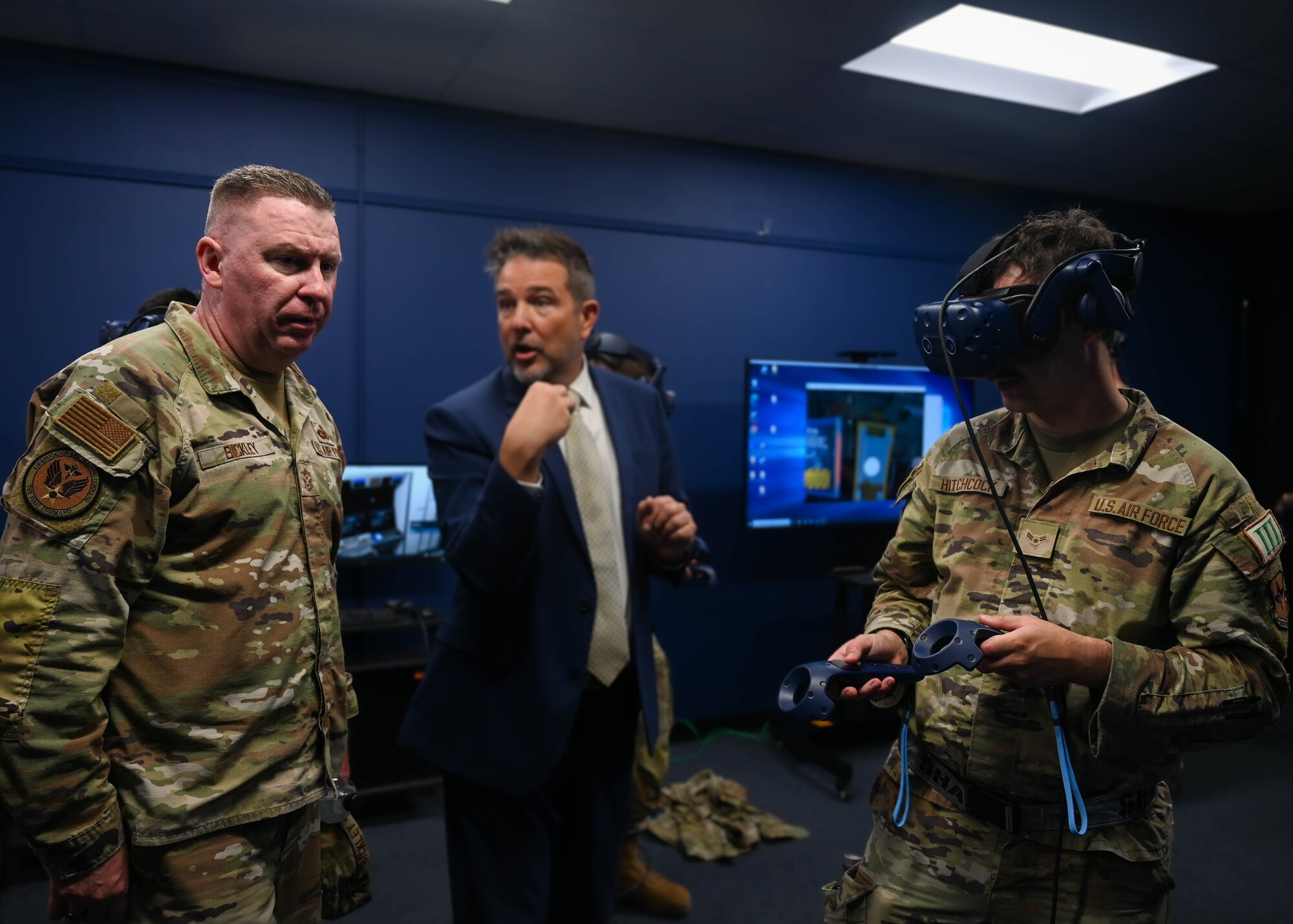 U.S. Air Force Chief Master Sgt. Chad Bickley, command chief for Air Education Training Command, watches a demonstration of virtual reality gear used for training at Goodfellow Air Force Base, Texas, May 10, 2024. The VR headset is utilized to place trainees in specific real-life scenarios, that offer a closer look at the details of their individual Air Force specialties. (U.S. Air Force photo by Senior Airman Zach Heimbuch)