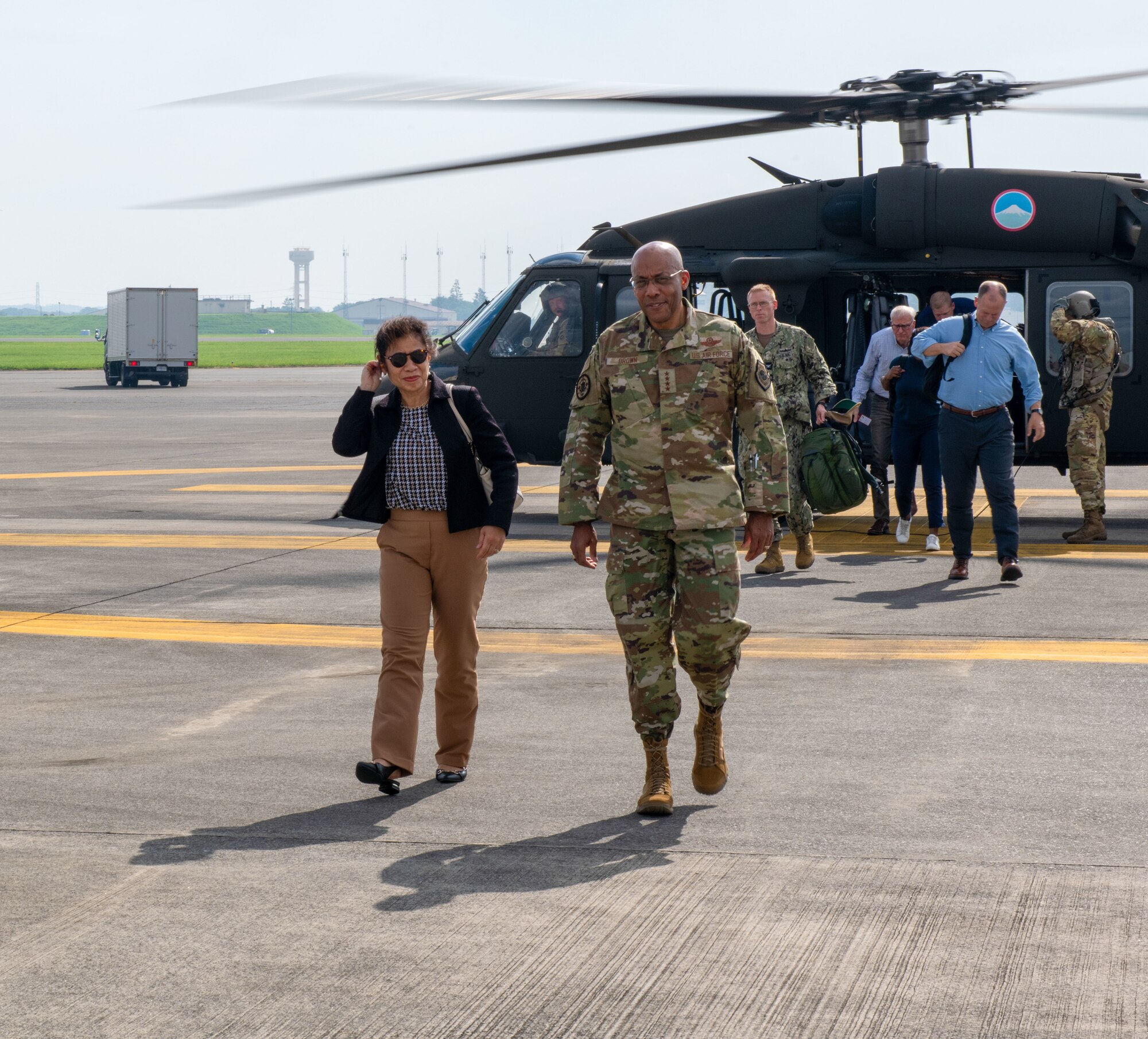 U.S. Air Force Gen. Charles Q. Brown Jr., Chairman of the U.S. Joint Chiefs of Staff, and his spouse Sharene Brown, arrive by helicopter on at Yokota Air Base, Japan.