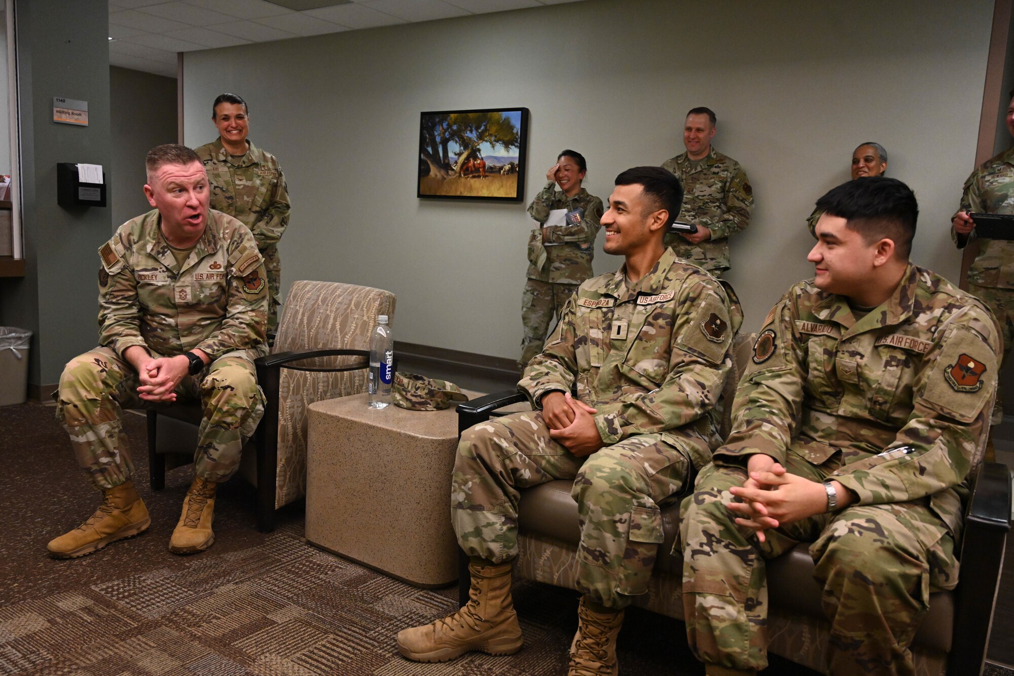 U.S. Air Force Chief Master Sgt. Chad Bickley, command chief of Air Education and Training Command, speaks to 1st Lt. Aziel Espinoza, 97th Operational Medical Readiness Squadron (OMRS) Public Health Flight commander, and Airman Basic Alexander Alvarado, 97th OMRS public health technician, during a tour at Altus Air Force Base, Oklahoma, July 10, 2024. Bickley explained the critical role that Airmen play in executing the mission. (U.S. Air Force photo by Senior Airman Miyah Gray)