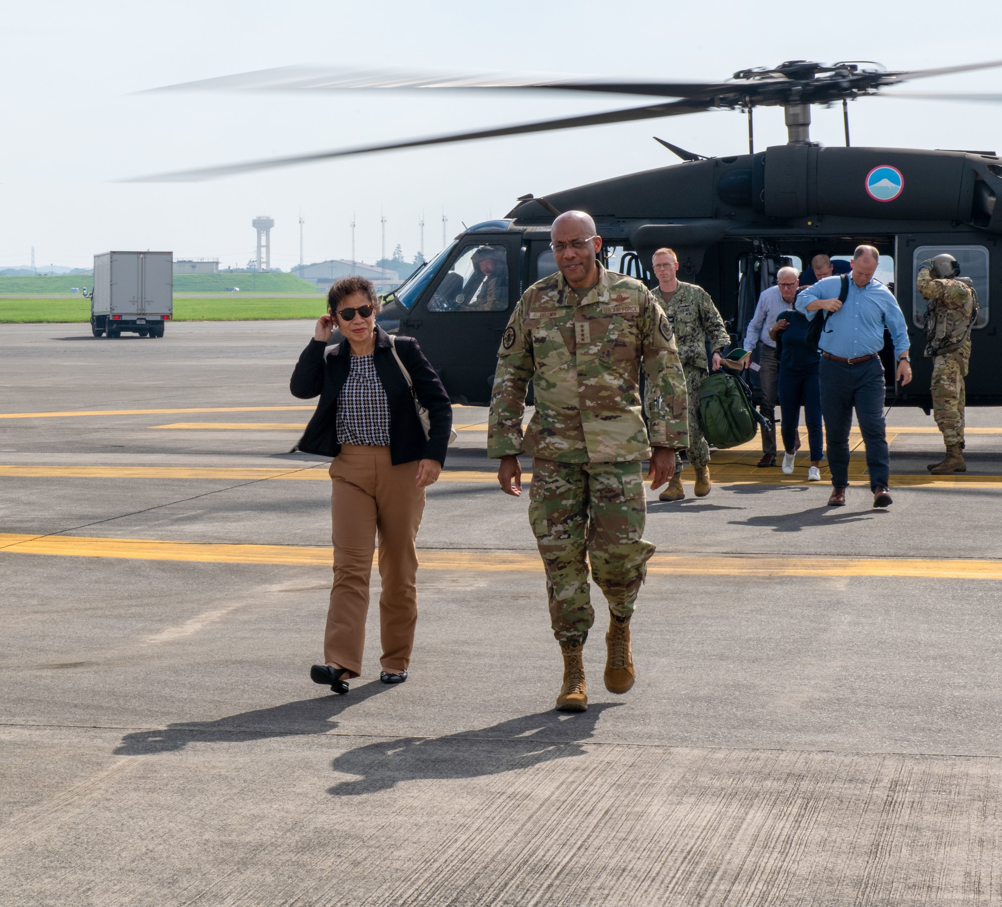 U.S. Air Force Gen. Charles Q. Brown Jr., Chairman of the U.S. Joint Chiefs of Staff, and his spouse Sharene Brown, arrive by helicopter on at Yokota Air Base, Japan.