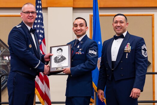  Spc. 4 Scott Adorno poses for a photo with leadership while receiving the John L. Levitow Award.