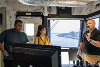 SINGAPORE (July 23, 2024) Civil service mariner Capt. Aaron Reiss, captain of the Spearhead-class expeditionary fast transport ship USNS City of Bismarck (T-EPF 9), right, gives a tour to local reporters, during a scheduled port visit to Singapore Naval Installation (SNI) as part of Pacific Partnership. Now in its 20th iteration, Pacific Partnership series is the largest annual multinational humanitarian assistance and disaster relief preparedness mission conducted in the Indo-Pacific. (U.S. Navy photo by Mass Communication Specialist 1st Class Jomark A. Almazan)