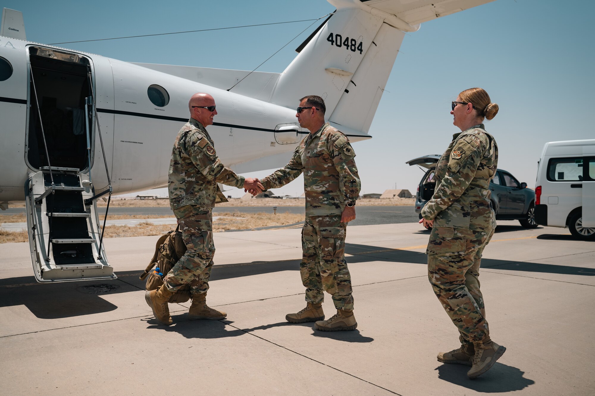 Chief Master Sgt. of the Air Force David Flosi
shakes hands with Col. Sergio Anaya, 386th
Air Expeditionary Wing commander.