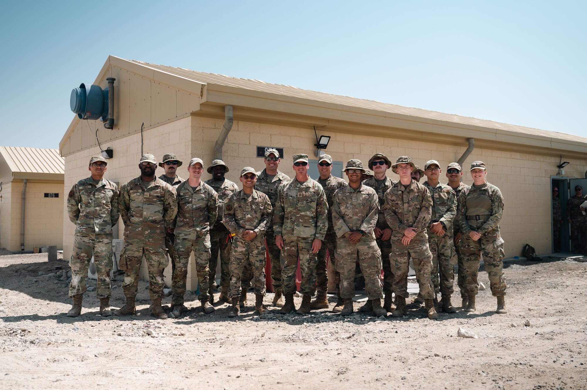 Chief Master Sgt. of the Air Force David Flosi
poses for a group photo with Airmen from the
386th Expeditionary Civil Engineer Squadron.