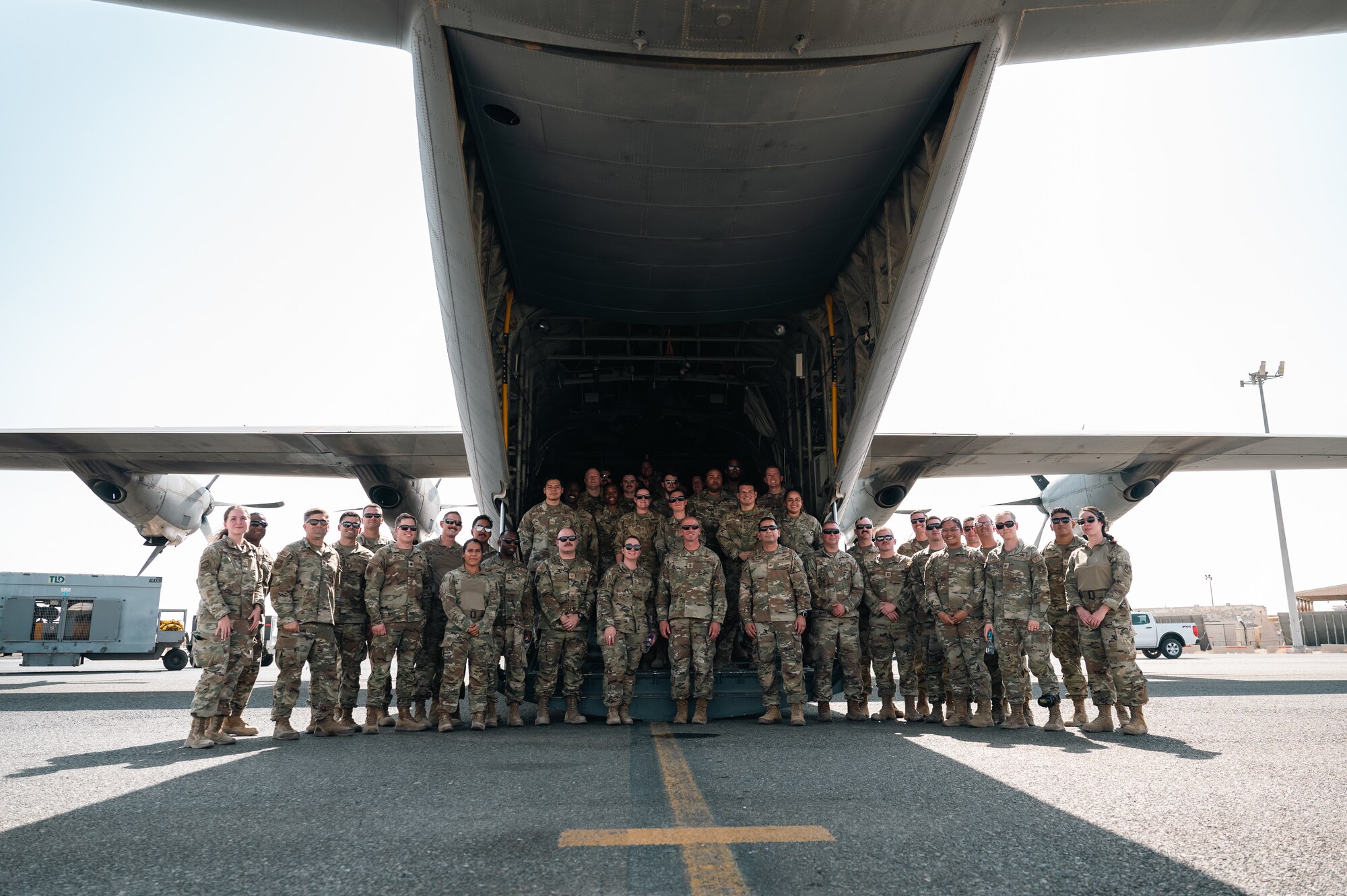 Chief Master Sgt. of the Air Force David Flosi
poses for a group photo with Airmen