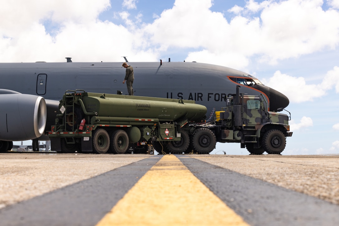 U.S. Marine Corps Cpl. Kannon Cissell, a petroleum quality assurance and additization specialist with Marine Wing Support Squadron 172, 1st Marine Aircraft Wing, refuels a KC-135 Stratotanker on Marine Corps Air Station Futenma, Okinawa, Japan, July 2, 2024. Airmen with the 909th Air Refueling Squadron and the 909th Aircraft Maintenance Unit, and Marines with Marine Wing Support Squadron 172 and MCAS Futenma, refueled a KC-135 Stratotanker shortly after its arrival to the air station. Cissel is a native of Missouri. (U.S. Marine Corps photo by Cpl. Thomas Sheng)