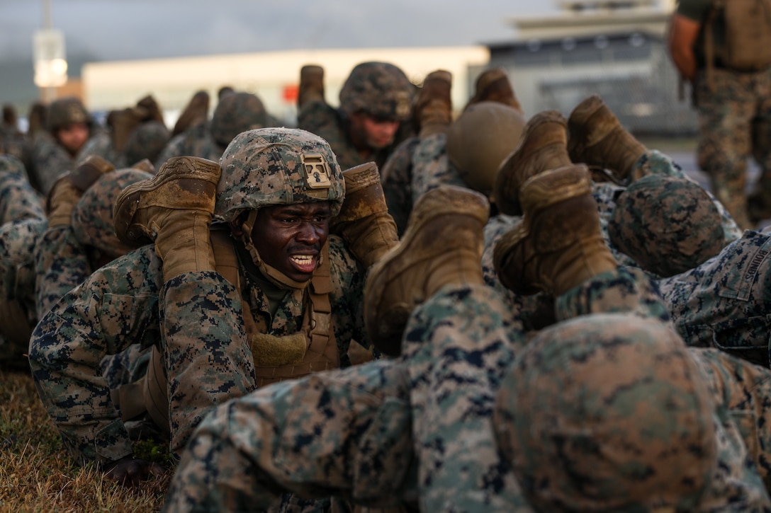 U.S. Marines with Marine Medium Tiltrotor Squadron (VMM) 363’s Martial Arts Instructor class 91-24 conduct push-ups during their culminating event, Marine Corps Base Hawaii, June 26, 2024. Marines conducted the event across the installation over the course of eight hours, demonstrating their martial arts proficiency, culminating in their graduation to earn the military occupational specialty of 0916, martial arts instructor.